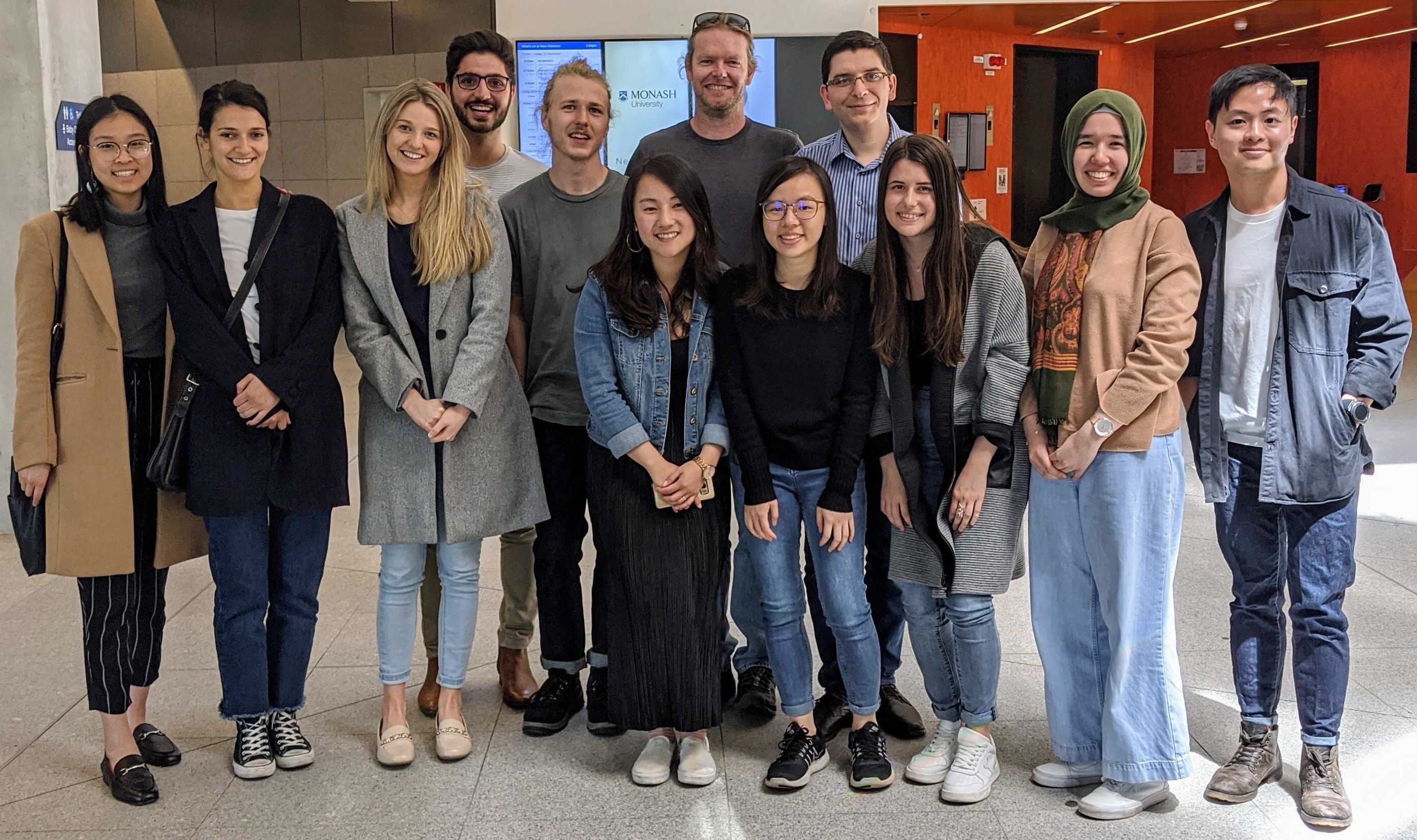 Group photo of the Behavioural Medicine Lab in 2019, in a building foyer