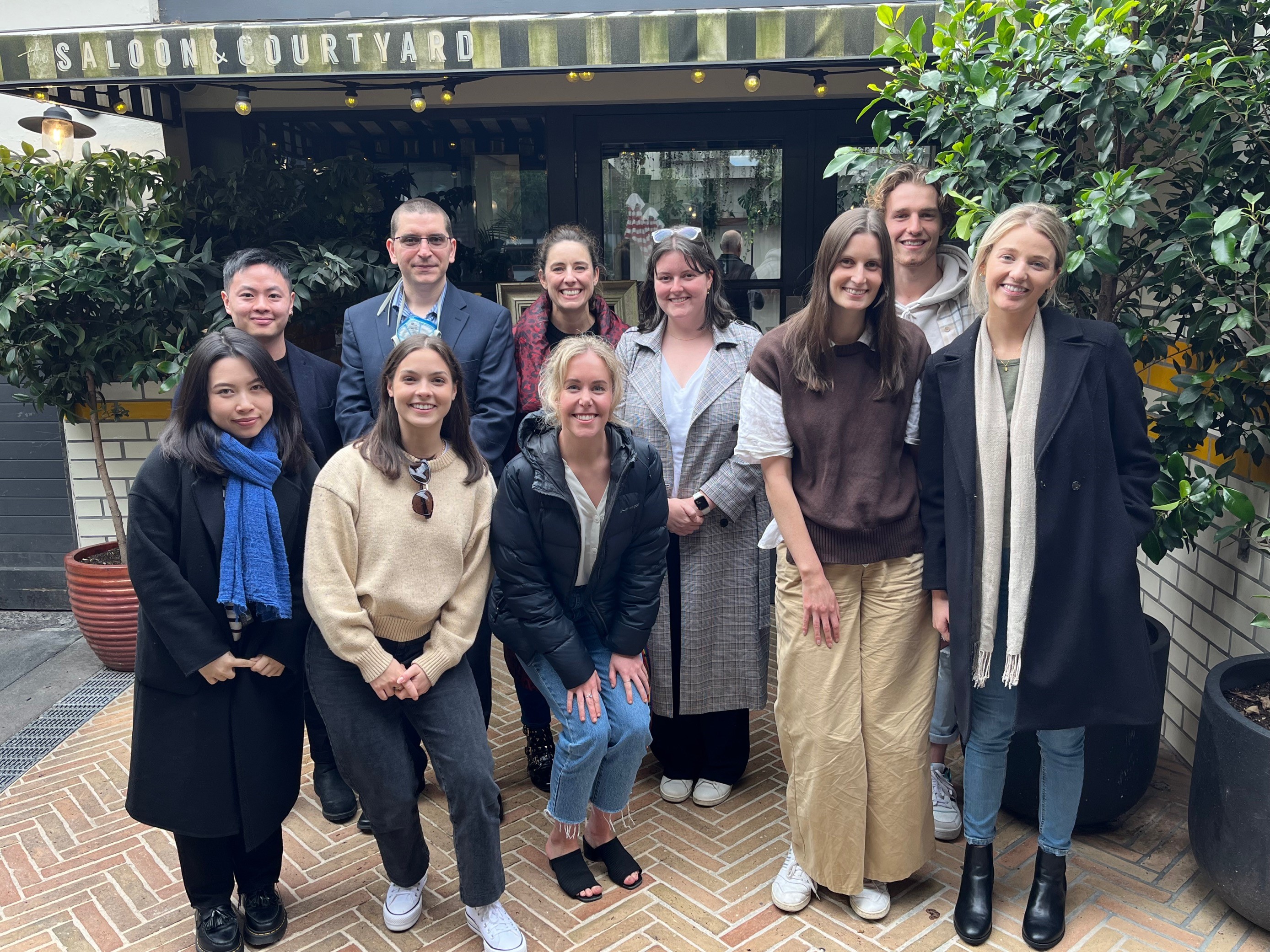 Group photo of the Behavioural Medicine Lab in 2022, in a courtyard